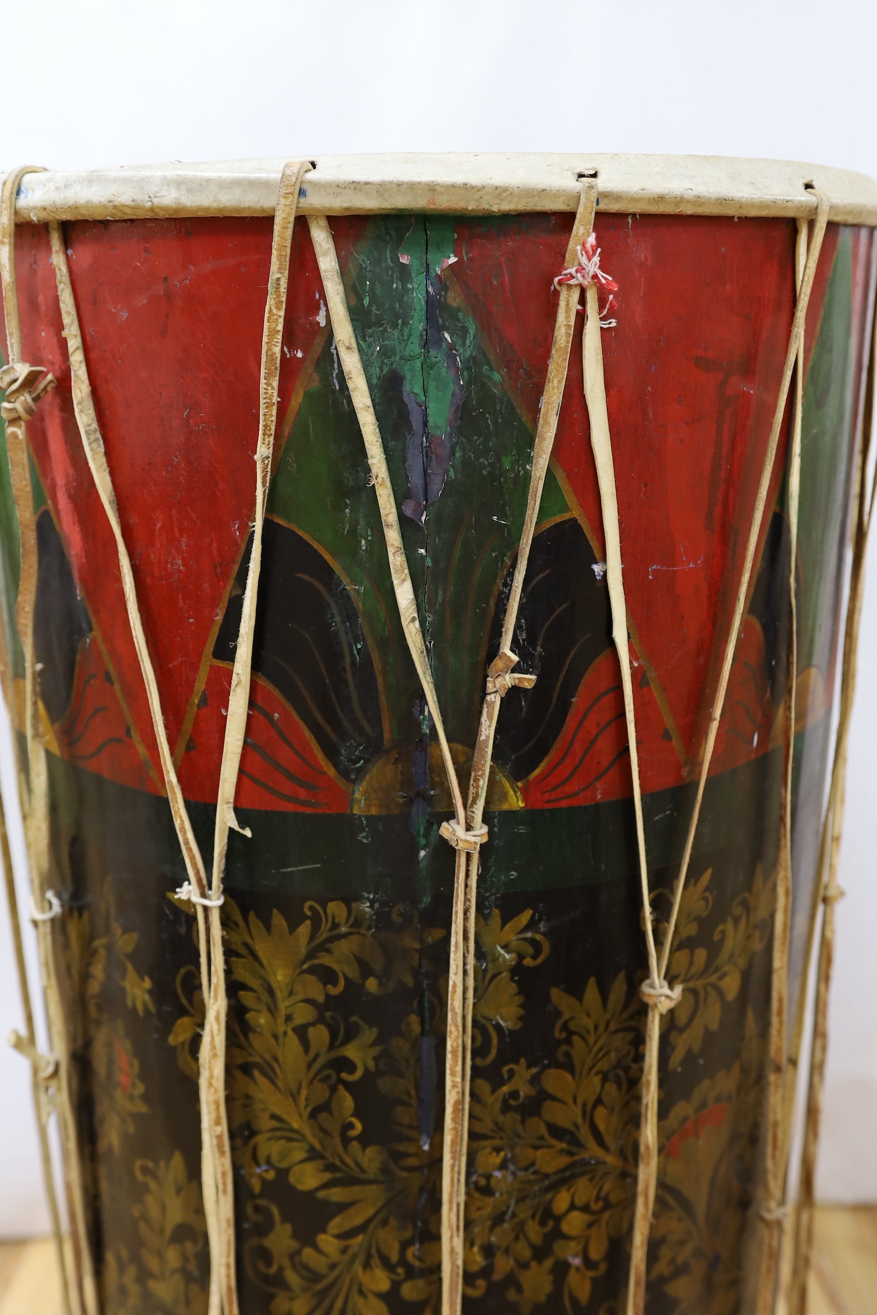 A large sub Saharan tribal drum, 96cm tall